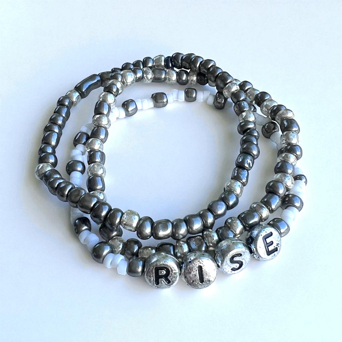 "Rise" 3-Piece Bracelet Stack – Gunmetal & Silver Glass Beads with Acrylic Letter Beads | 6.5-Inch Elastic Set